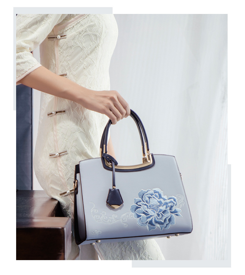 Ladies Elegant Burgundy Handbag with Floral Embroidery And Gold-Tone Hardware